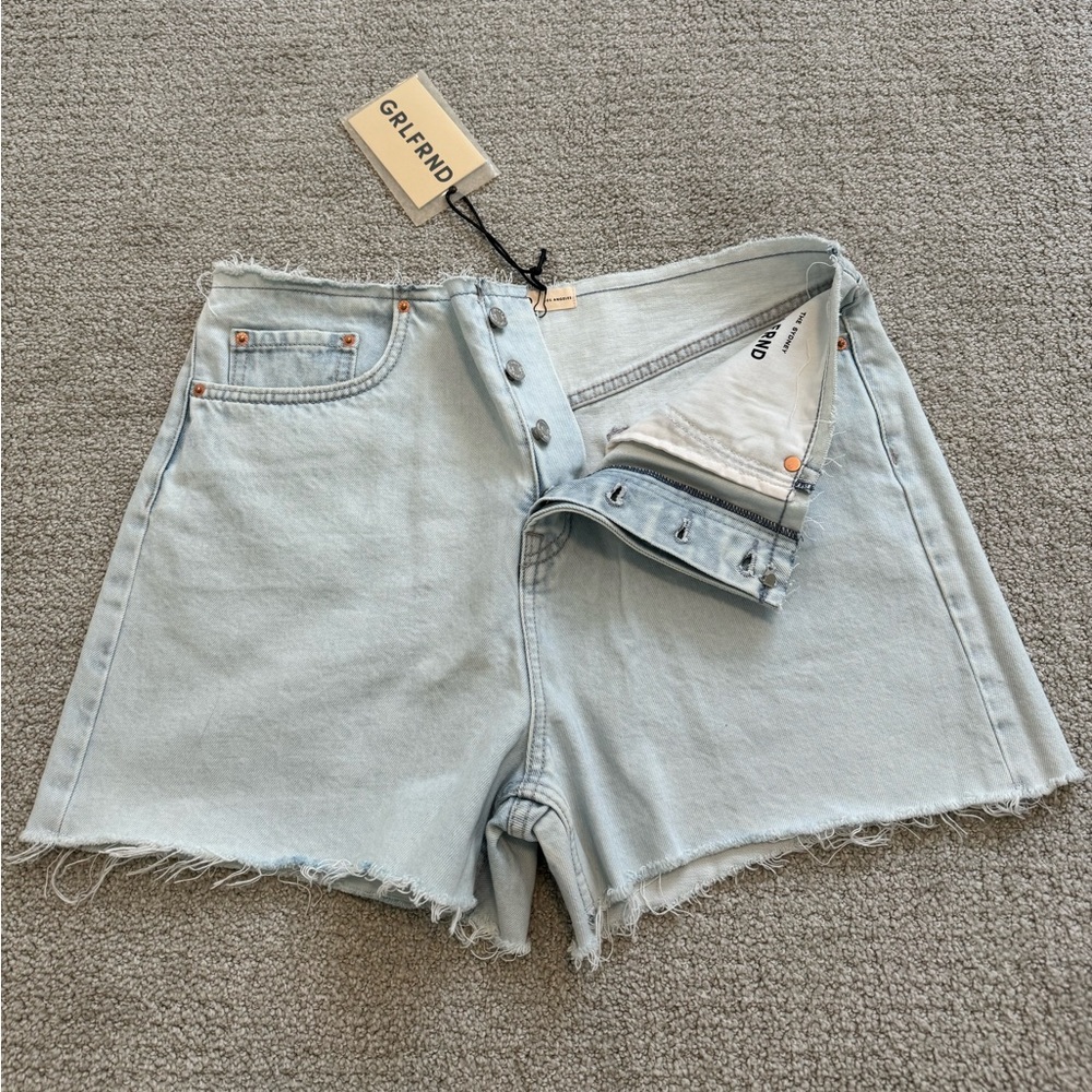 Brand new GRLFRIEND light denim cut off shorts